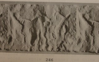 Naked hero grasping wild goat (ibex) on either side