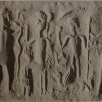 Deity sitting on throne approached by two worshippers (modern [i.e., fake])
