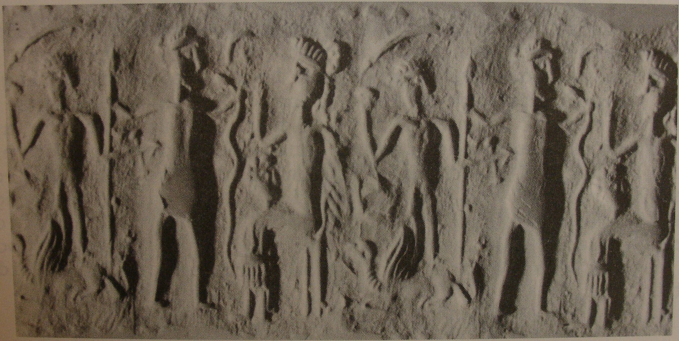 Deity sitting on throne approached by two worshippers (modern [i.e., fake])