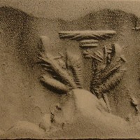 Two scorpion-tailed bird-men facing each other below winged sun-disc
