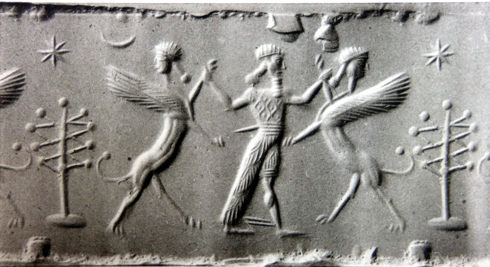 Hero grasping human-headed winged lion (shedu, sphinx) on either side