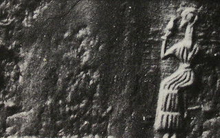 Sitting figure drinking from small vessel (late Middle or Neo-Elamite)