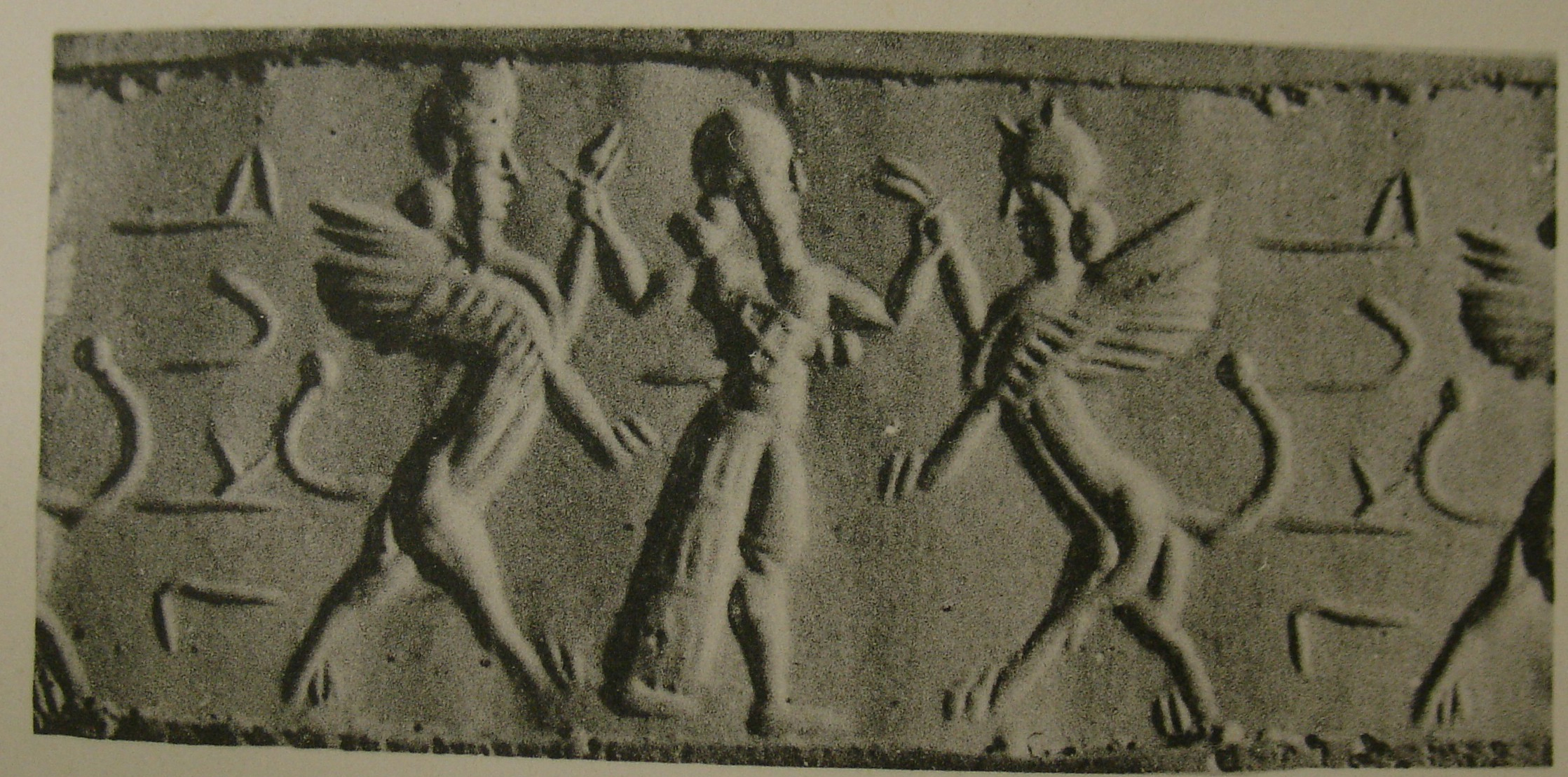 Hero grasping human-headed winged lion (lamassu, sphinx) on either side