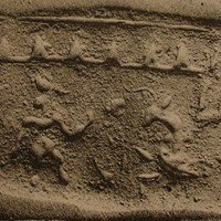 Naked human figure facing charging bull