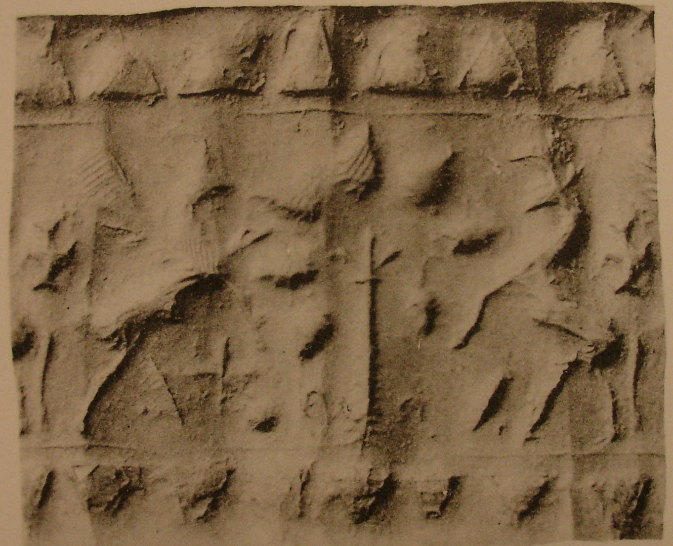Rampant griffin and bull flanking stylised tree