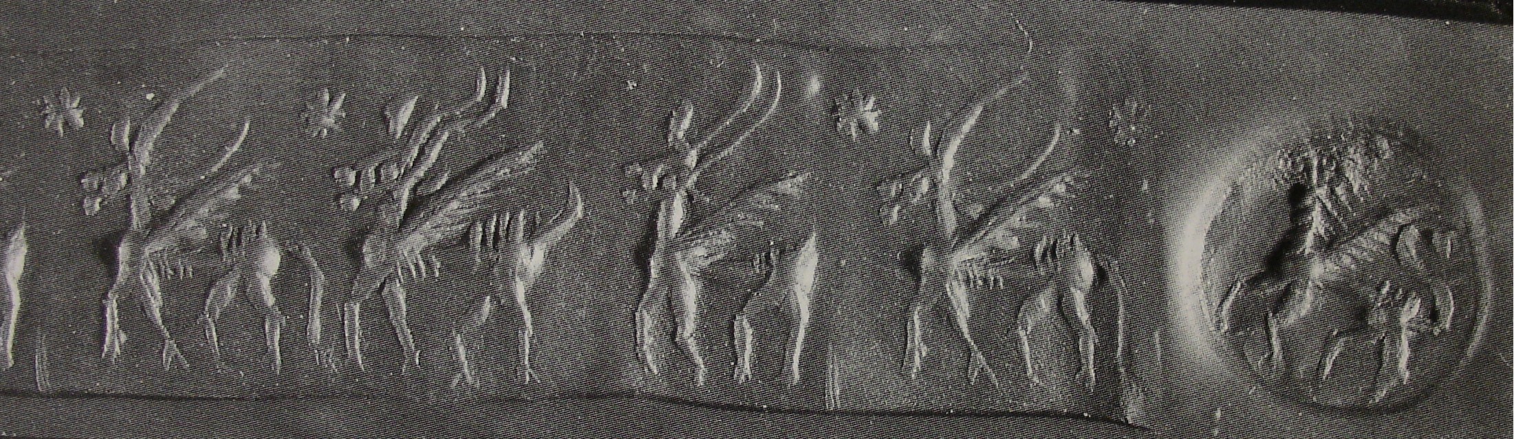 Stamp-cylinder seal: Three winged hybrid creatures following each other (cylinder image) – winged hybrid creature (stamp image)