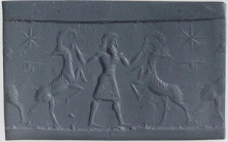 Hero grasping wild goat (ibex) on either side