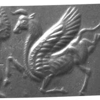 Winged bull prancing in front of tree