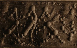 Hero grasping human-headed winged lion (shedu, sphinx) on either side